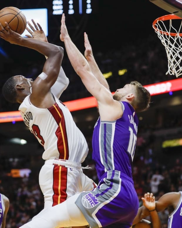 Nov 2, 2022; Miami, Florida, USA; Miami Heat center Bam Adebayo (13) shoots over Sacramento Kings forward Domantas Sabonis (10) during the fourth quarter at FTX Arena. Mandatory Credit: Sam Navarro-USA TODAY Sports